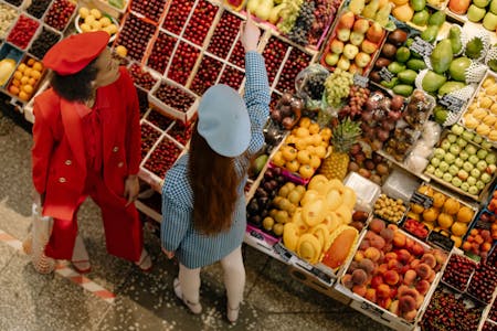 woman buying fruits in a grocery store woman buying fruits in a grocery store
